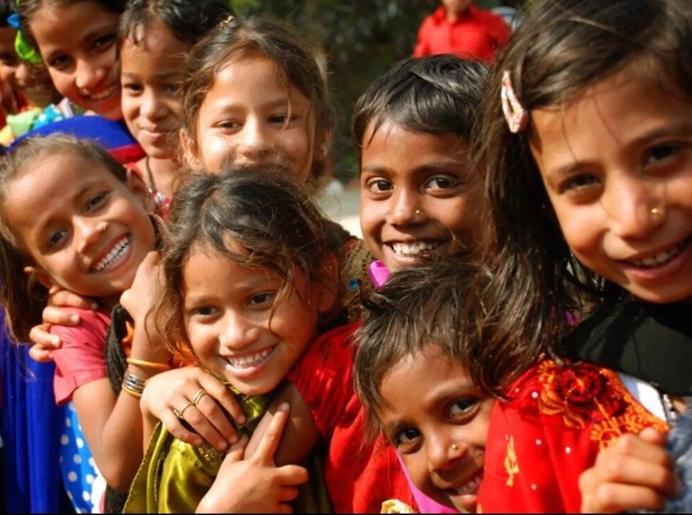 Cheerful group of children smiling together for the camera